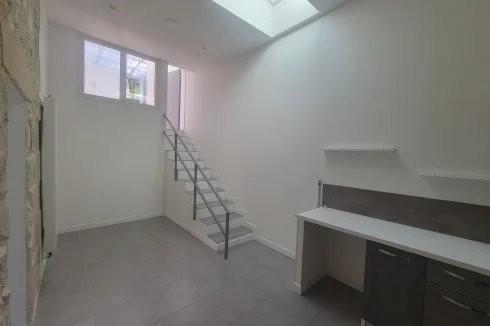 Skylight in kitchen/dining area and stairs leading to conservatory and upstairs