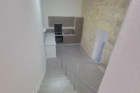 Stairs leading up to conservatory from kitchen/dining area