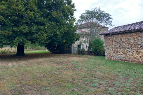 Rear view of stone barn and house