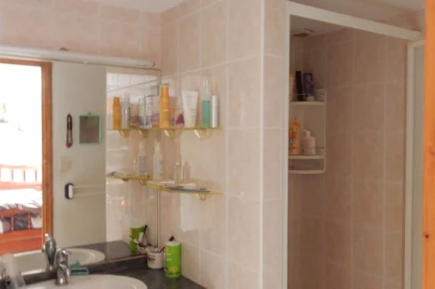 Bathroom overlooking a bedroom on the ground floor