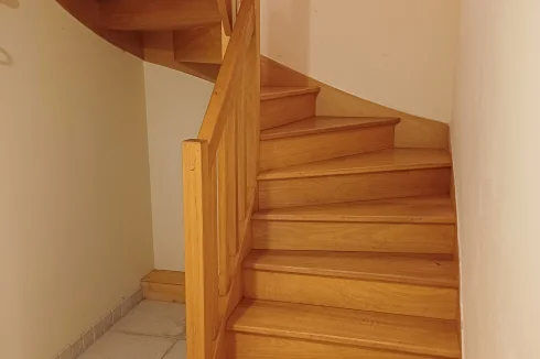 Stairs to fully tiled ground floor