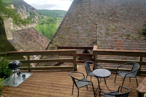 Decking behind the house with views of the village