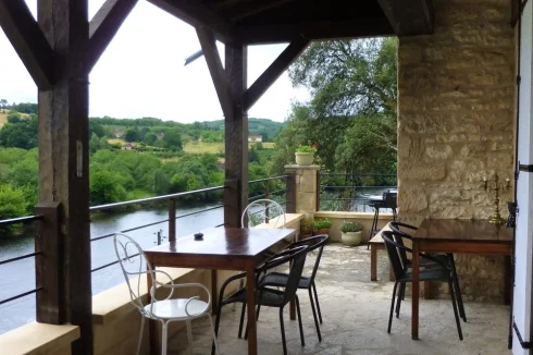 Large covered terrace overlooking the river