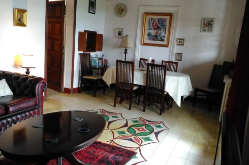 Living room showing dining area and door to kitchen