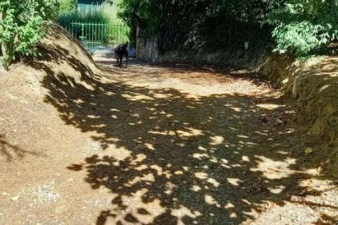 House to entrance gate