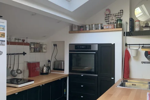 The kitchen with a large roof window