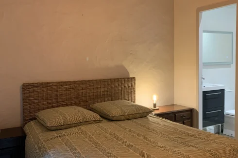 The main bedroom with the wooden beams