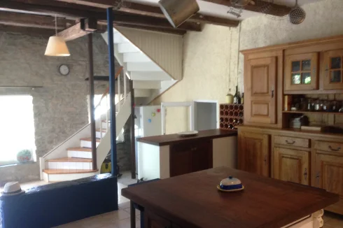 Kitchen view to lounge and stairs.