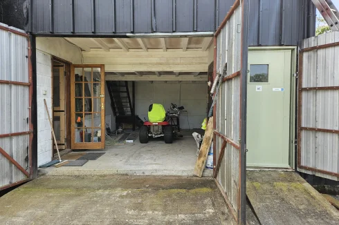 House garage and entrance to client's shower/wc