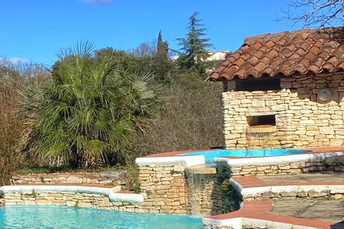 Swimming pool and water falls. Mont Bouquet view behind the water falls