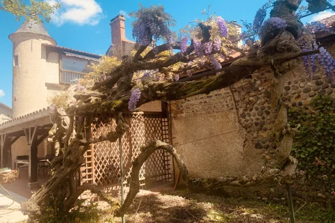 Back view of the turret and lovely wisteria