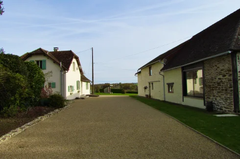 Both properties separated by large gravel drive.