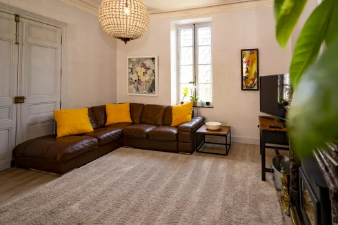 Main residence living room with original fire place