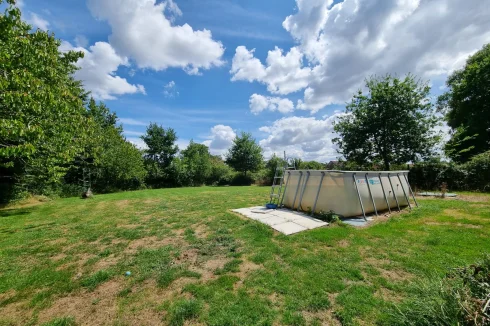 Side garden with above ground pool