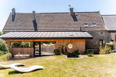 A reinvented Norman farmhouse, a subtle combination of old-world charm and an elegant contemporary extension.