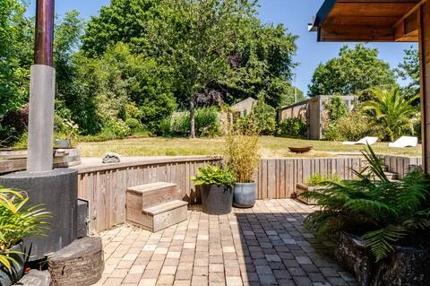 A refined outdoor space, where mineral elegance combines with the ingenuity of the wood-burning stove that powers the Nordic bath, offering a unique well-being experience.