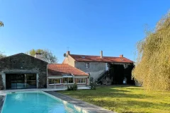 In the Peaceful Setting of a Rural Hamlet, this Farmhouse, Renovated in the 2000s, Offers Exceptional Living Space and E…