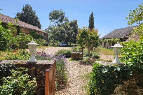 Looking from house to gravelled courtyard and outbuildings