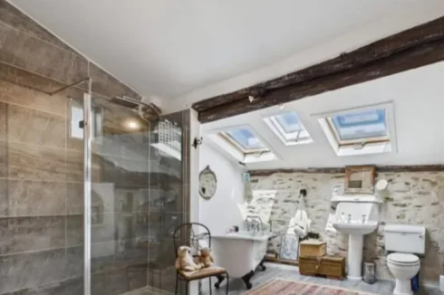 Family bathroom featuring shower & Roll top bath